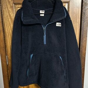 The North Face Men’s Navy Fleece 1/4 zip pullover. Very cozy and warm